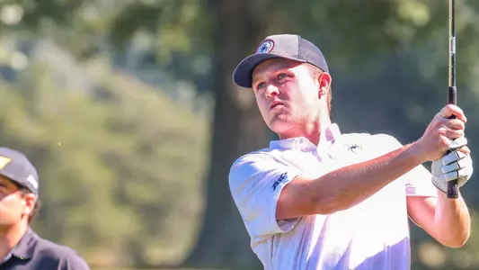 Lou Baker stares down his tee shot on a par 3