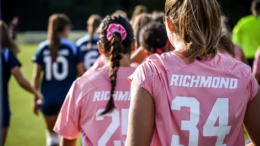 Photo of Sofia Mancino and Casey Merz during the National Anthem
