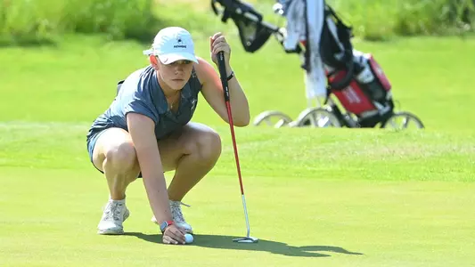 Hannah Lydic lines up her putt on the green
