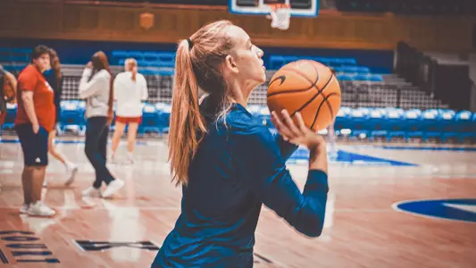 Kylee Lewandowski shooting a ball inside Cameron Indoor Stadium