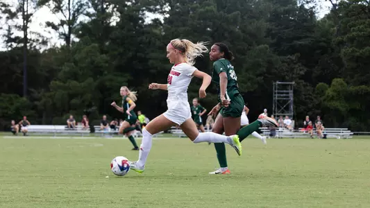 Photo of Molly Wierman taking a shot on goal