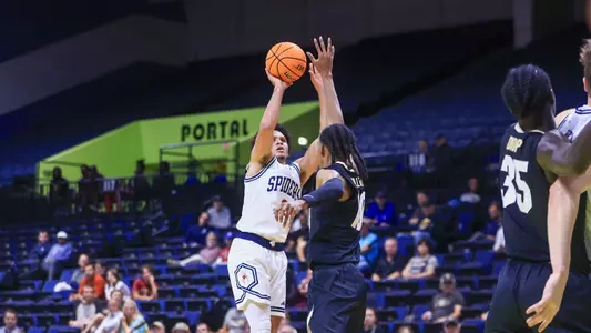 Jordan King shoots a jumpshot over a defender