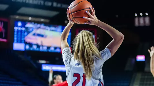 Kylee Lewandoski inbounding a pass during a basketball game
