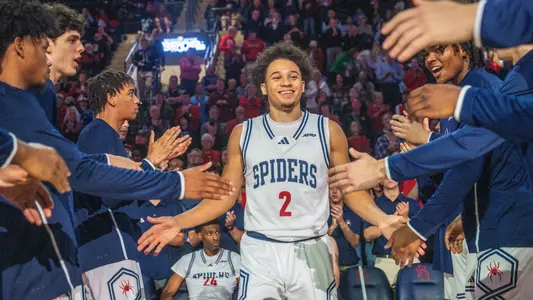 Jordan King shakes hands with his teammates while being introduced during starting lineups