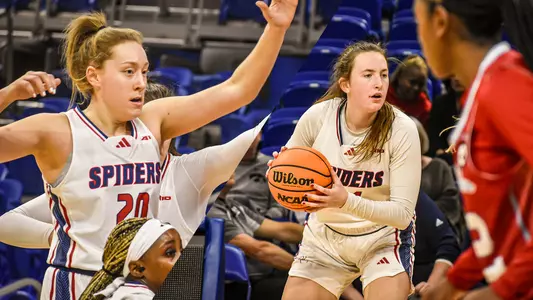 Budnik and Doogan playing in a basketball game vs La. Tech