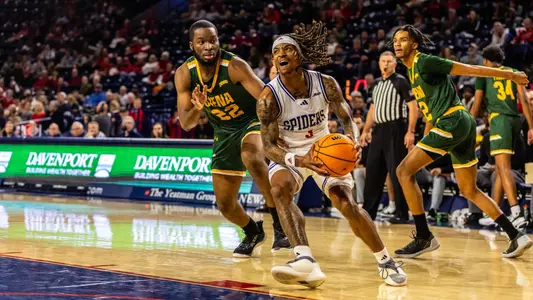 DeLonnie Hunt drives the baseline against Siena