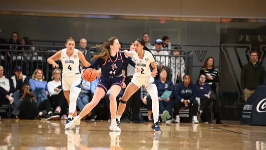 Maggie Doogan posting up against a defender vs Villanova