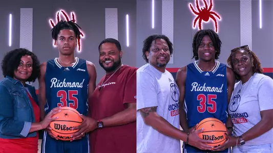 Bryson McGlothin and his mom and dad stand in the Queally Athletics Center. Jaylen Robinson and his mom and dad stand in the Queally Athletics Center.