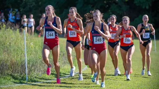 Elizabeth Stockman and Madison Trippett leading a pack of runners side by side
