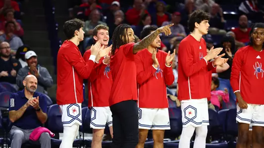DeLonnie Hunt points to a teammate from the bench during a game