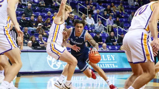 Dji Bailey runs into his defender in the middle of the lane