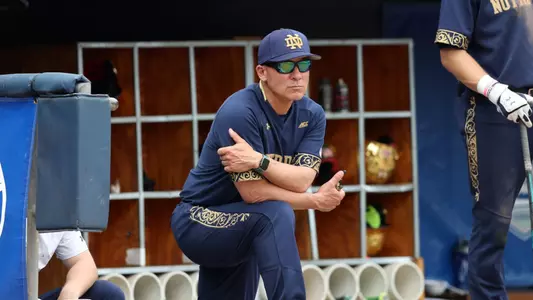 Mik Aoki in the dugout during his tenure as the head coach at Notre Dame.