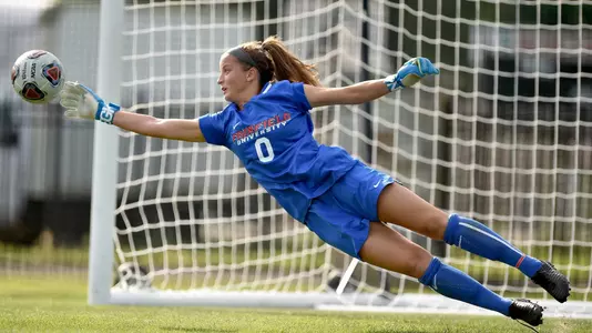 Gena Pike saving a shot inside the goal