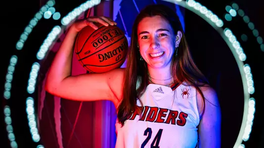 A photo Faye Parker holding a basketball
