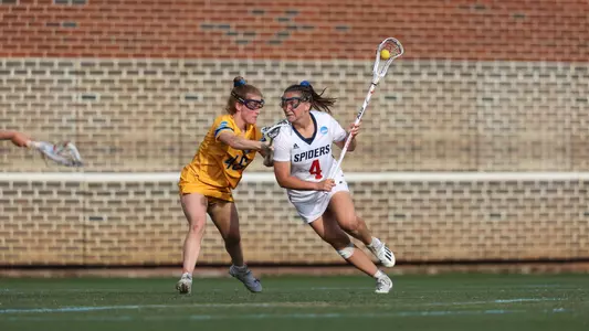 Richmond Women's Lacrosse attacker Arden Tierney pushes towards the goal vs Marquette.