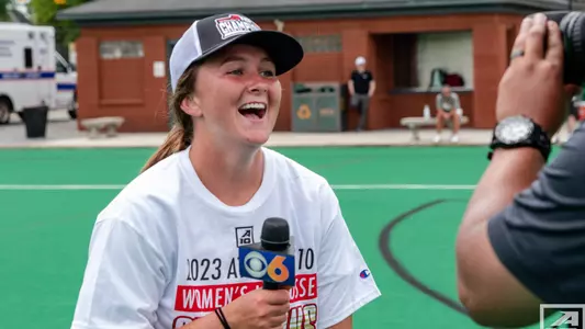Arden Tierney smiling as she is being interviewed by a local news station