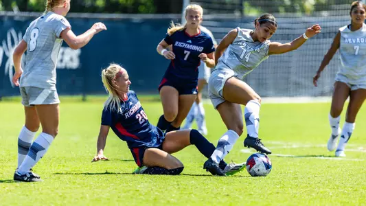 Photo of Molly Wierman tackling the ball against a Nevada Player