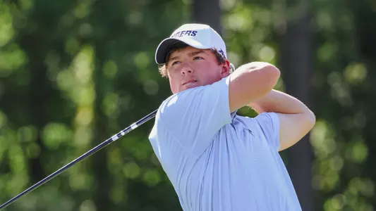 Owen Pearce holds his follow through following a tee shot.
