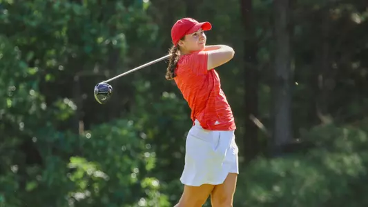 Christine Mandile watches her tee shot from the tee box.