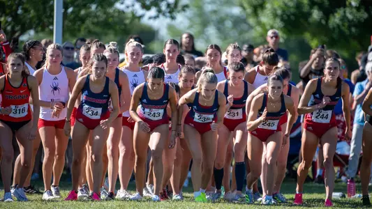 Group of women cross country runners getting ready to take off at the Spider Alumni Open