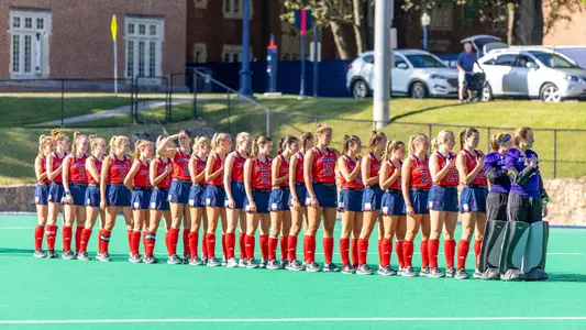 Spider Hockey team is lined up for the national anthem