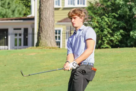 Jack LaPiana chips onto the green at Independence Golf Club.