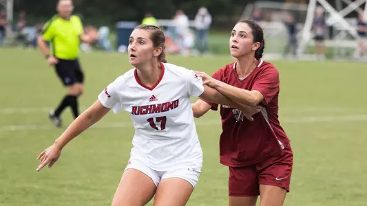 Kathryn Lennon defending the ball against a SJU player