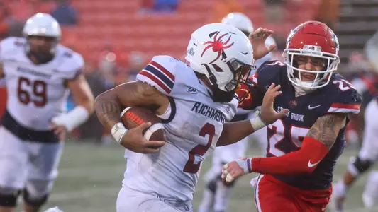 Savon Smith delivering a menacing stiff arm during Richmond's 20-19 win at Stony Brook, Sept. 23 2023