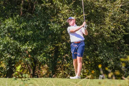 Cole Ekert stares down his drive from the tee box.