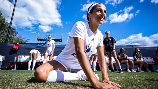 Sofia Mancino stretching before a soccer game