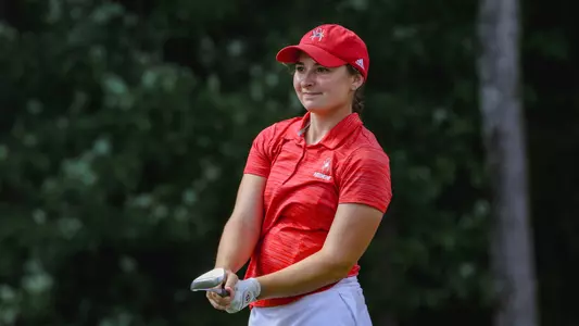 Christine Mandile leans to her left while watching her approach shot.