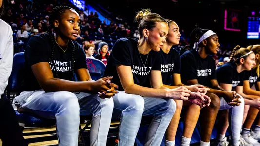 Photo of Anna Camden, Jada Green on the bench during a basketball game
