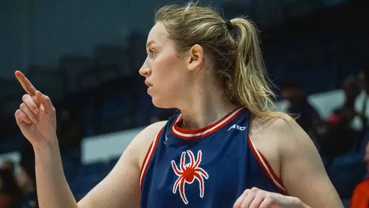 Katie Hill pointing to another player during th eWBB game vs GW