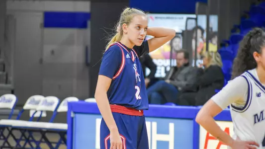Kylee Lewandowski Fixing her hair during a game