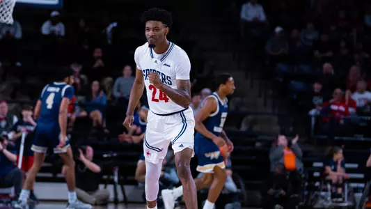 Isaiah Bigelow pumps his fist after making a shot vs George Washington