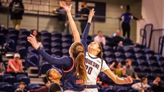 Maggie Doogan tipping off a basketball game