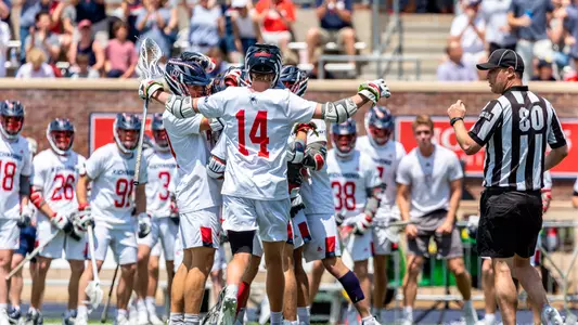 Luke Grayum celebrates a goal with teammates during Richmond's 2023 A-10 Championship win over High Point