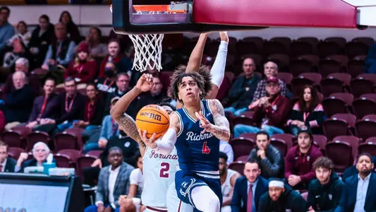 Dji Bailey drives for a reverse layup at Fordham