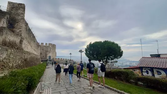 Richmond student-athletes in Greece on a walk among the ruins in Thessaloniki