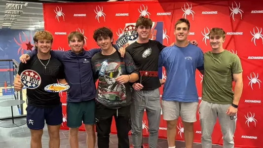 Student-athletes pose for a photo at a Voting Rights Event