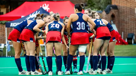Spider Field Hockey huddle prior to the start of the second half