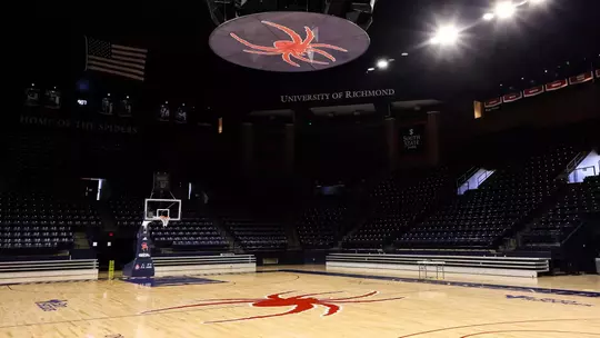 Empty Robins Center looking up at the Spider above the court