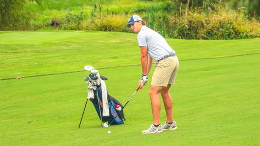 Tommy Sharps stands over an approach shot