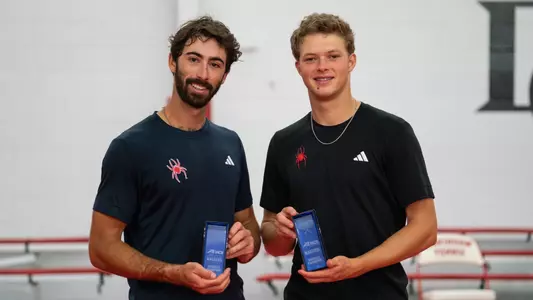 Cole Brashear and Davis Wiley holding the A-10 qualifier winning plaques