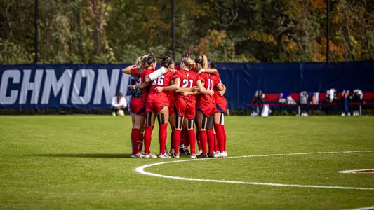 Women's soccer huddled preagame