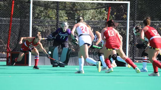 Field hockey goalkeeper Kristen Rake keeps her eye on the ball as a Maryland defender tries to redirect the ball into the goal