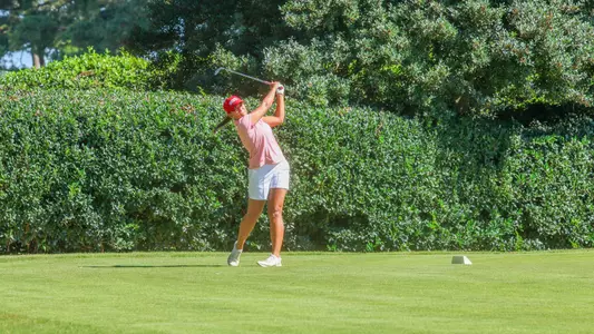 Maya Beasley fires an iron shot from the tee box