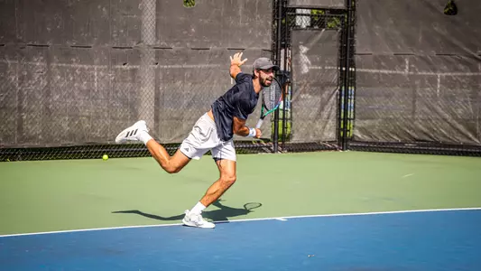 Cole Brashear hitting a tennis ball