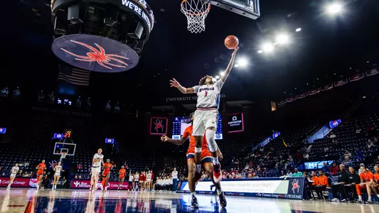 Alicia Newell shooting a layup