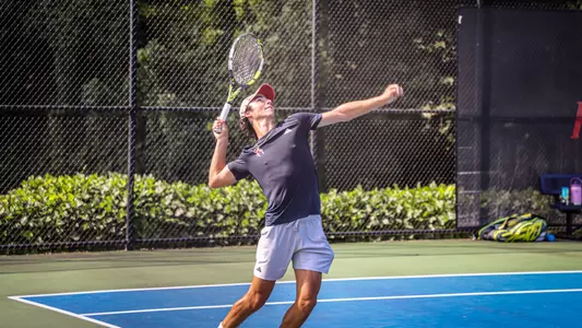 Grant Cohen serving the ball